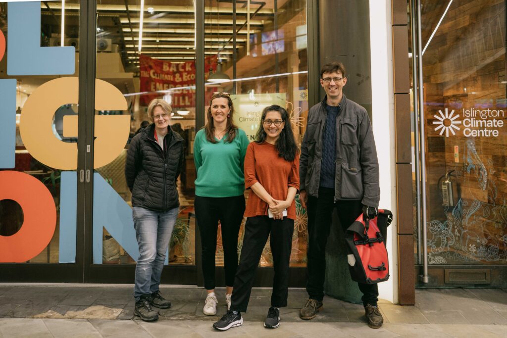 A photo of 4 people outside the Islington Climate Centre
