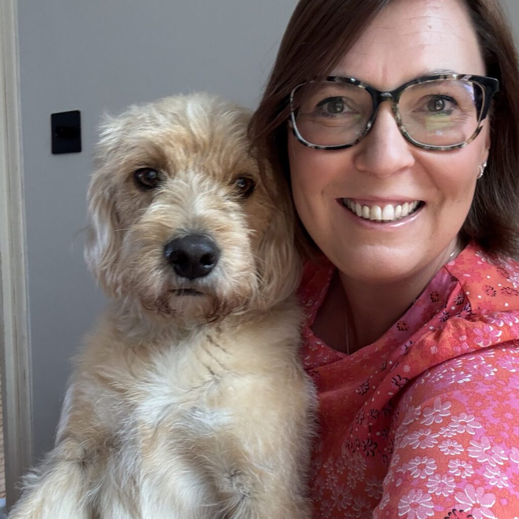 Isabella Griffiths headshot with her dog