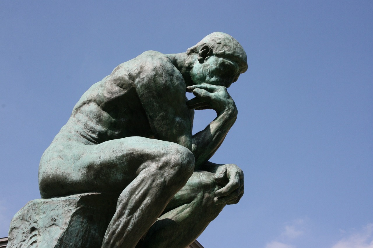 Rodin the Thinker against a blue sky, Image from Pixabay