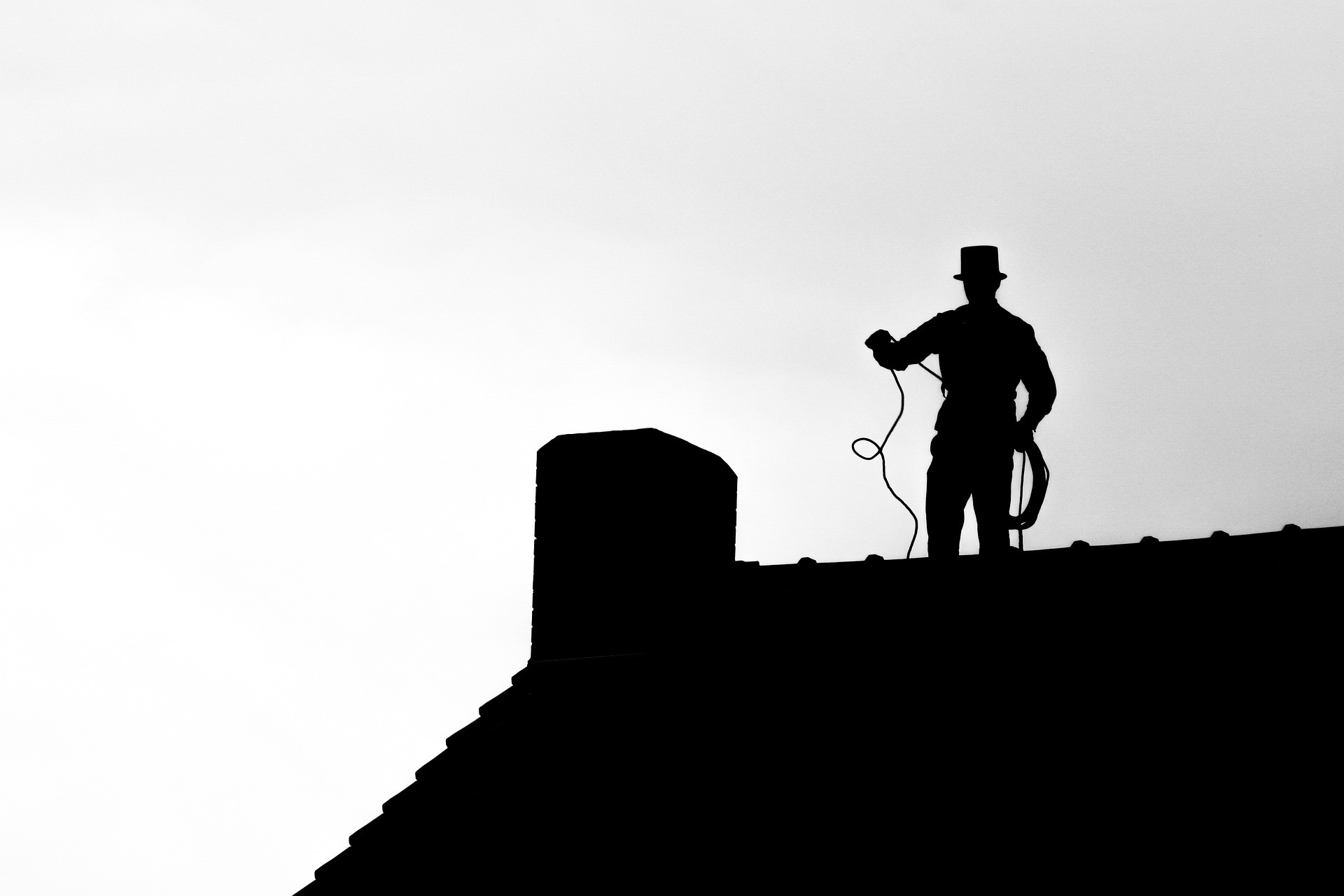 A silhouette of a chimney sweep. Image by Steven Helmis from Pixabay