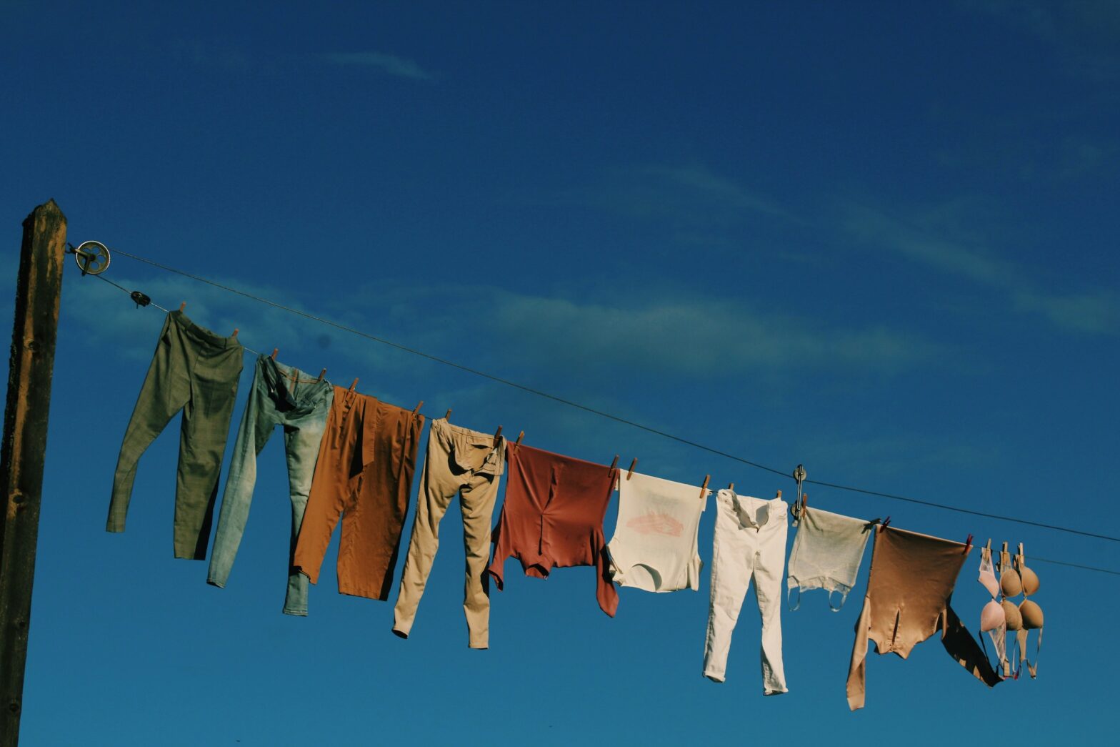 Laundry hanging on a line with a blue sky behind https://unsplash.com/photos/white-and-blue-textiles-on-wire-during-daytime-zjasO1yZ6hQ