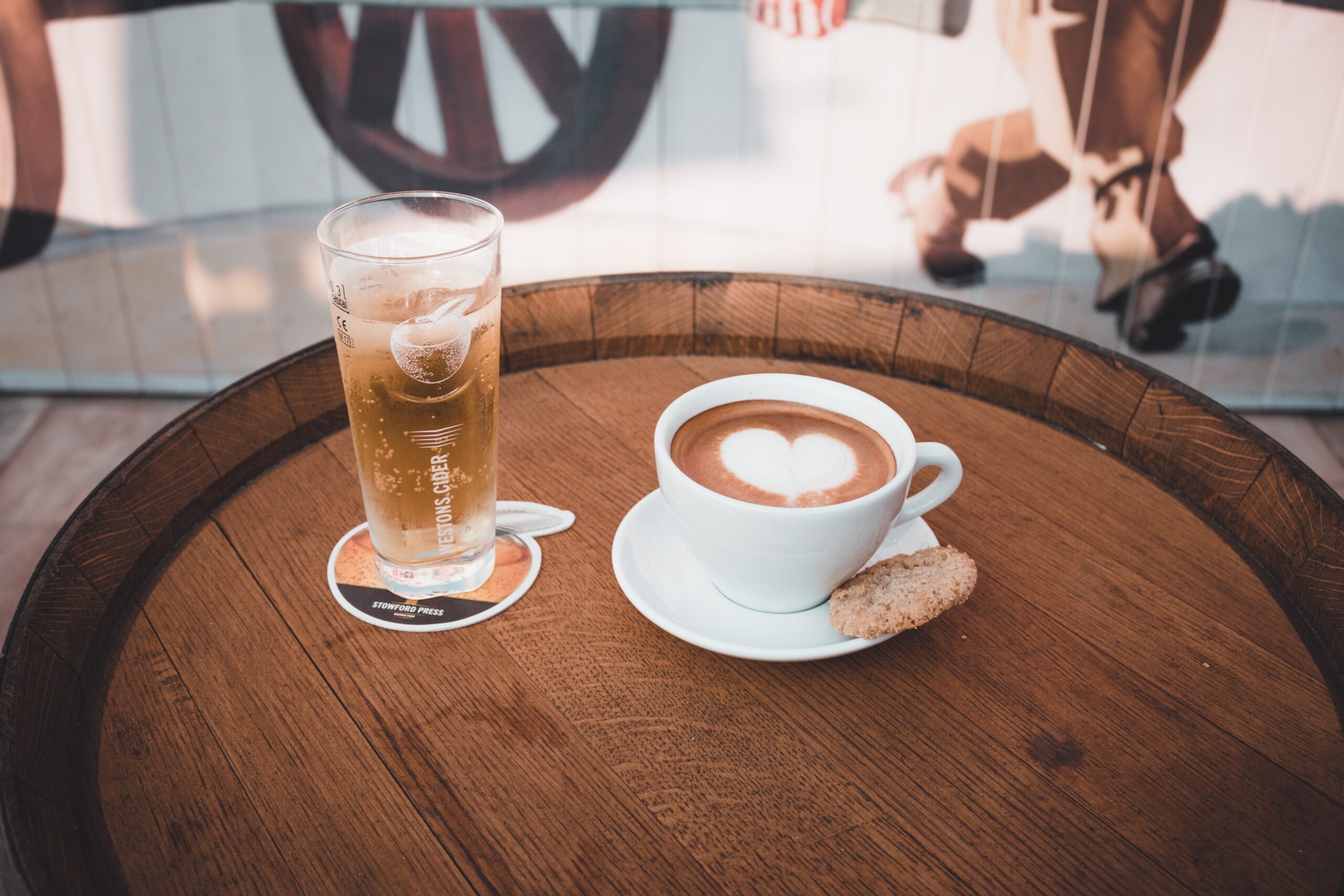 Photo showing a glass of water and a cup of coffee on a tray, by Ibrahim Rifath on Unsplash