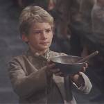 More please, asked Oliver, an orphan in rags with an empty bowl. A still from Oliver Twist